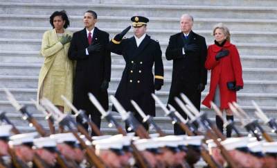 President Barack Obama with first lady Michelle Obama, and Vice President Joe Biden with wife Jill Biden, reviewing the troops at the start of the inaugural parade from the Capitol in Washington on Tuesday, Jan 20, 2009. Photograph by Manuel Balce Ceneta / AP