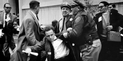Mario Savio, the leader of Free Speech Movement at Berkeley, being arrested by police, 1964