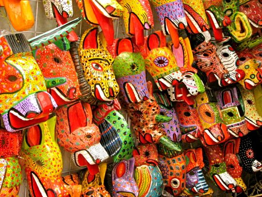 Mask-maker's booth, San Cristóbal de las Casas, mercado at Templo Santo Domingo, photo by Jim Cook