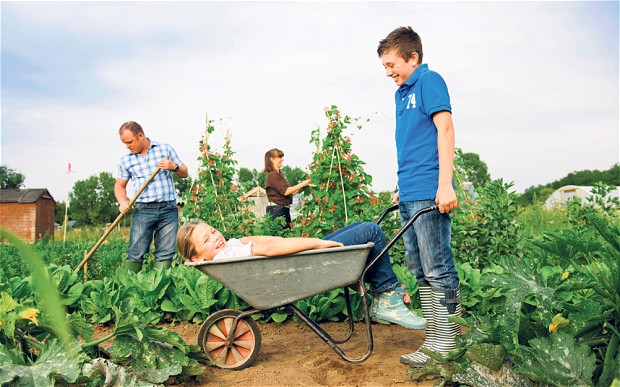 family gardening photo from UK Telegraph, story on allotment gardening, 17 April 2014