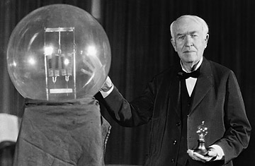 Thomas Edison exhibits a replica of his first successful incandescent lamp - credit, Bettmann-Corbis
