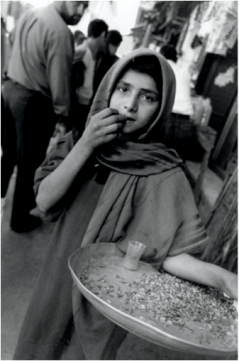 Olive Pierce, Girl selling seeds, Safaafir Market, Baghdad, 1999