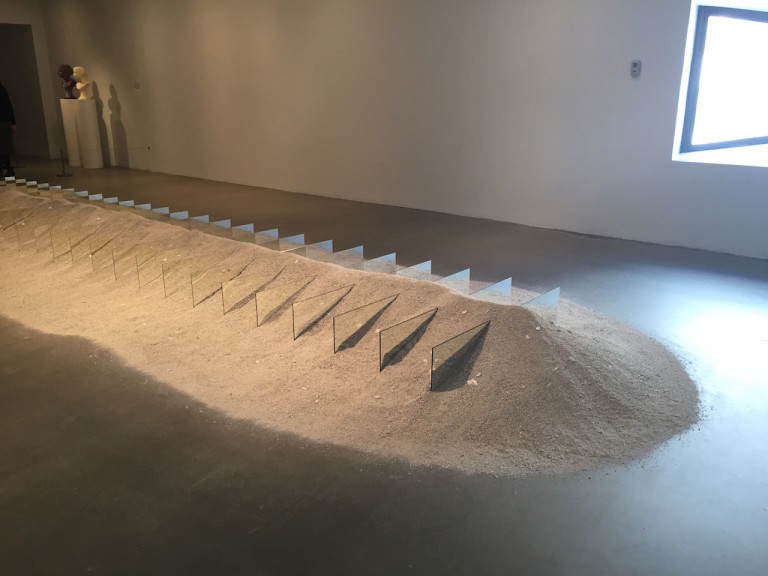 installation view of Robert Smithson's Mirrors and Shelly Sand, from Hyperallergic