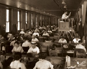A lector reads to cigar makers at Cuesta Rey and Company Cigar Factory, 1929